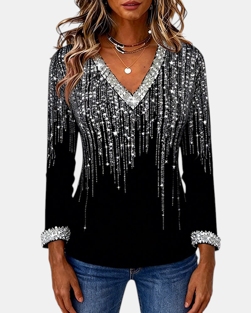 Margaret Dublin women's black blouse with V-neck, sparkly silver details and long sleeves.