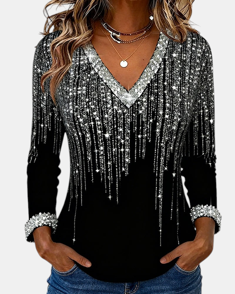 Margaret Dublin women's black blouse with V-neck, sparkly silver details and long sleeves.