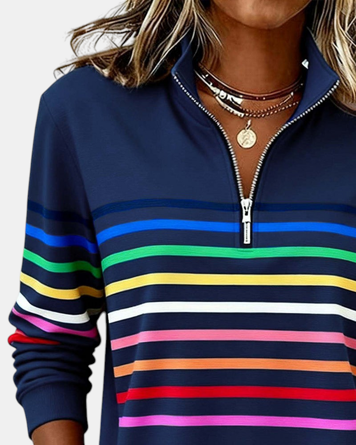 Sweater Margaret Dublin azul-marinho com riscas coloridas, gola alta com fecho e ajuste descontraído.