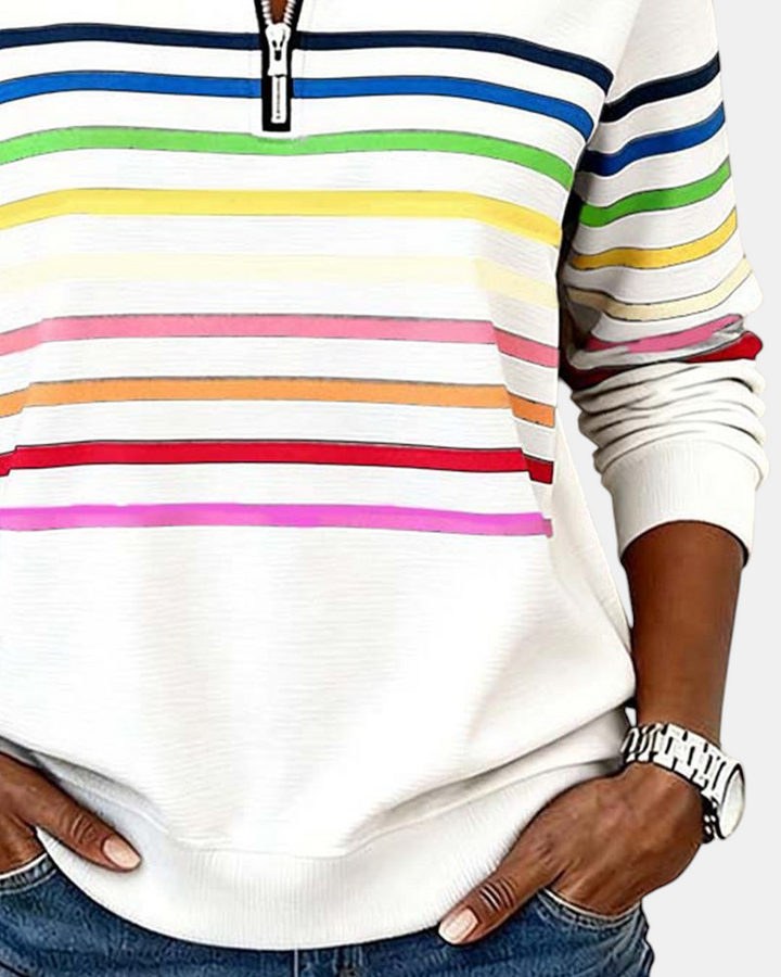 Camisola Margaret Dublin Marie com riscas coloridas, gola alta com fecho e corte descontraído em tecido branco.