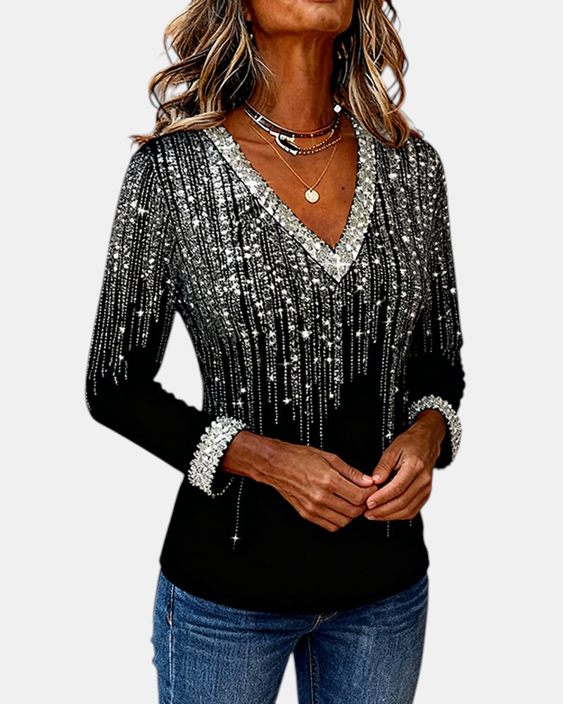 Margaret Dublin women's blouse with V-neck, sparkly silver details and long sleeves on a black background.