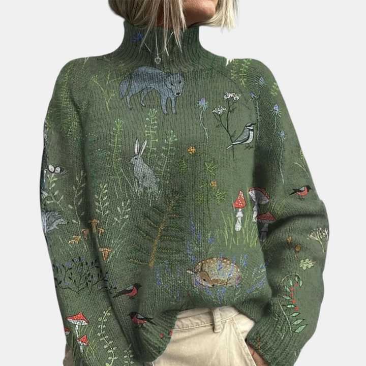 Margaret Dublin green high-neck jumper with an embroidered woodland animal and plant pattern in soft knit.