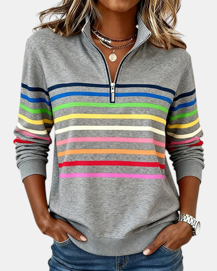 Sweater Margaret Dublin cinzento com riscas coloridas, gola alta com fecho e corte relaxado para mulher.