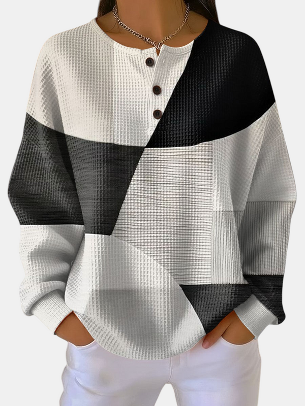 Margaret Dublin Ella sweatshirt with black and white geometric pattern, textured fabric and buttoned collar.