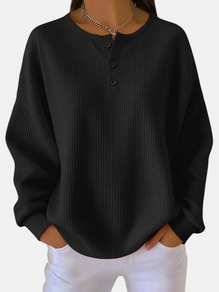 Margaret Dublin black waffle-knit jumper with henley collar and buttons, loose comfortable fit.