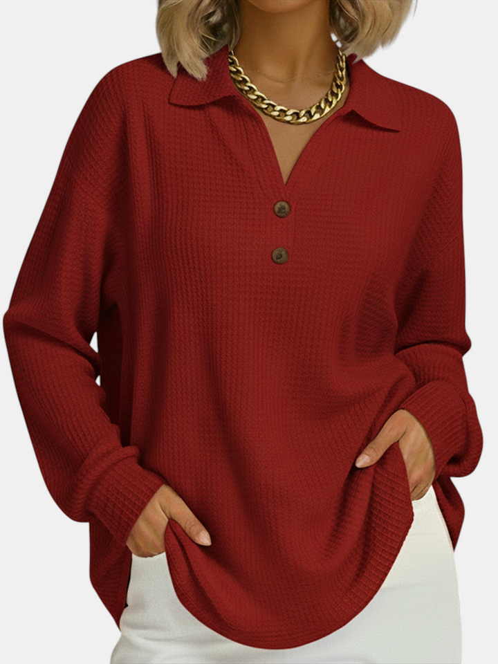 Margaret Dublin red sweatshirt with polo collar, buttons and waffle texture, ideal for a smart-casual look.