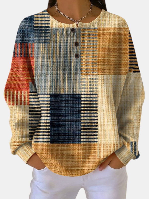 Margaret Dublin sweatshirt with multicoloured geometric pattern, buttoned round neck and soft, breathable fabric.