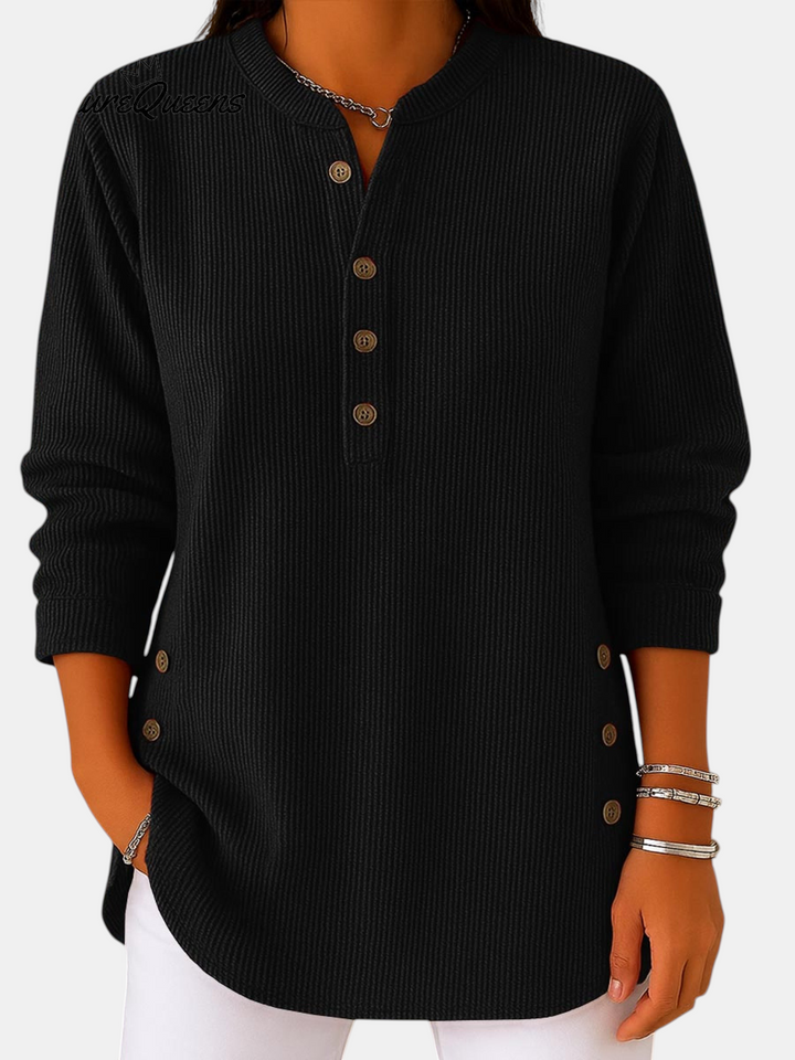 Margaret Dublin black tunic with buttoned neckline, long sleeves and ribbed texture, smart-casual style.