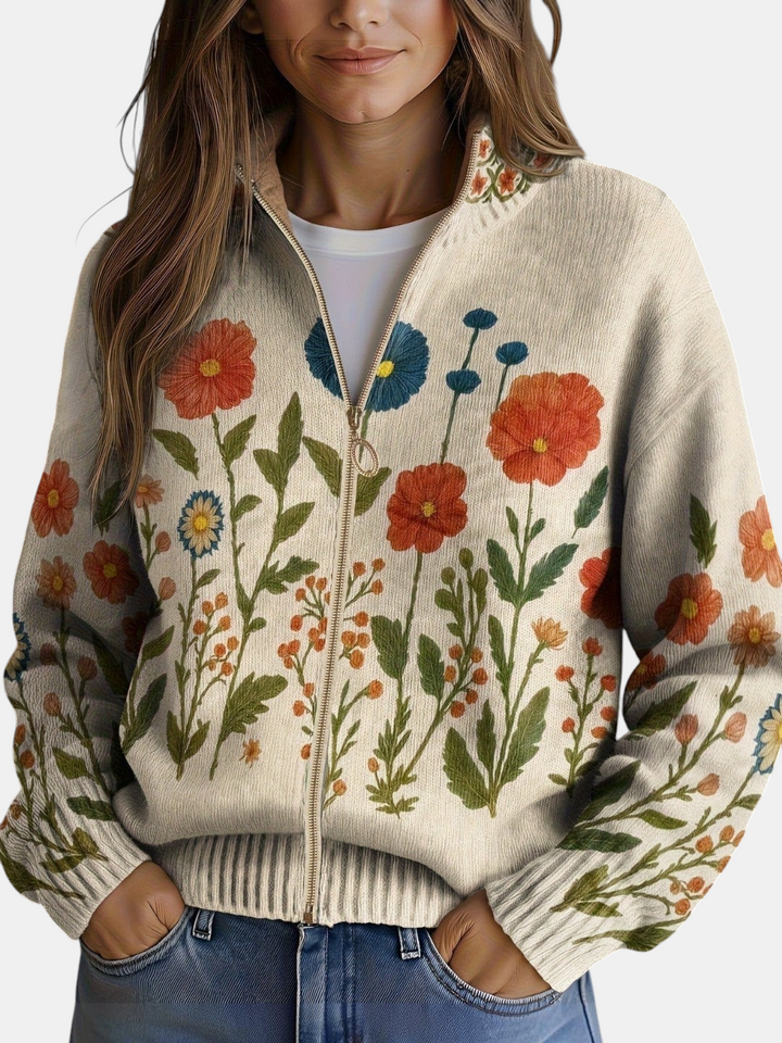 Cardigan de malha Margaret Dublin bege com estampado de flores silvestres, fecho dourado e gola alta canelada.