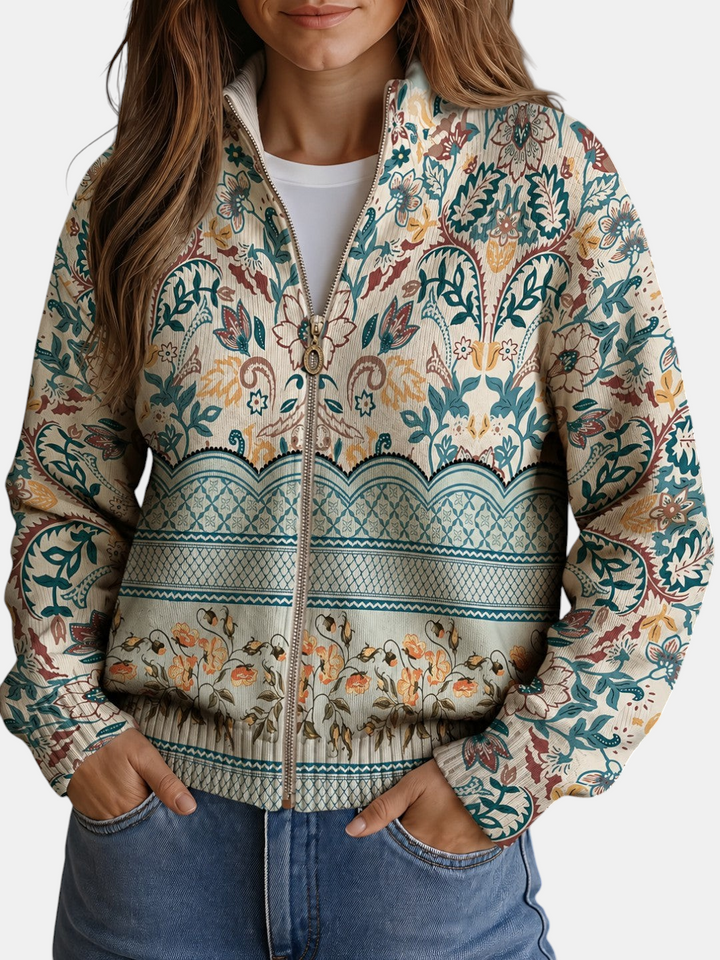 Cardigan de malha Margaret Dublin bege com padrão floral em tons de petróleo e laranja, fecho de correr e gola alta.