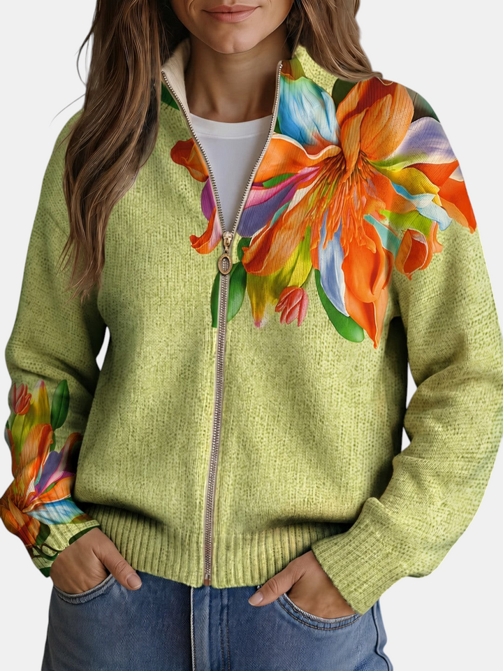 Cardigan de malha Margaret Dublin verde-claro com fecho e estampado floral de lírios em tons de laranja, azul e rosa.